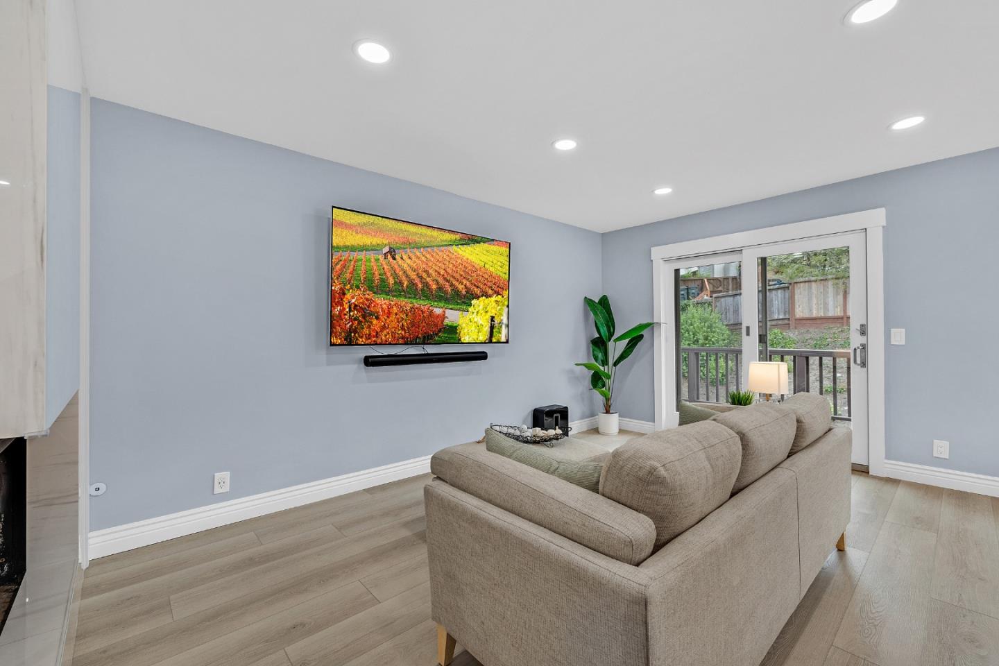 19 Elk Court Pacifica, CA 94044 - Photo 8 of 45 a living room with furniture and a flat screen tv