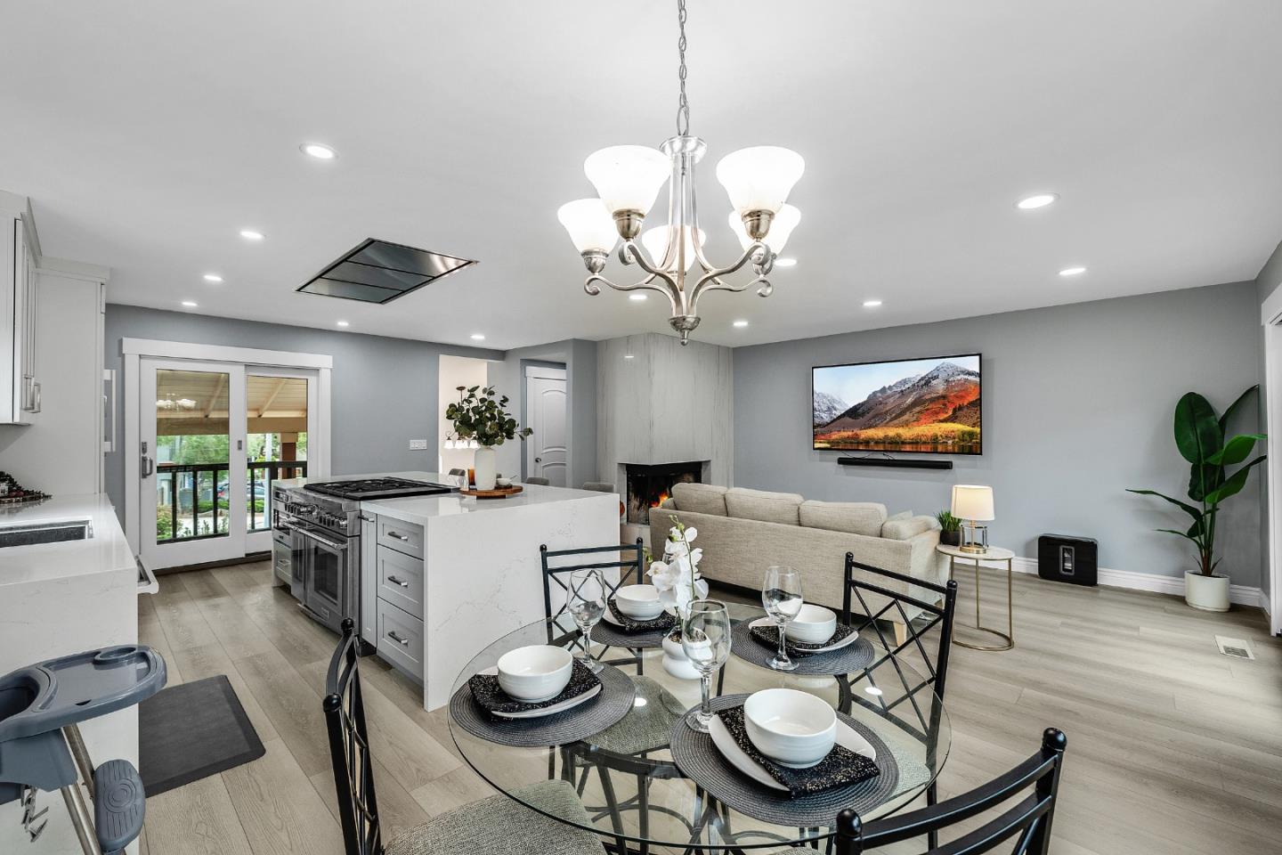 19 Elk Court Pacifica, CA 94044 - Photo 9 of 45 a view of a dining room with furniture a chandelier and wooden floor