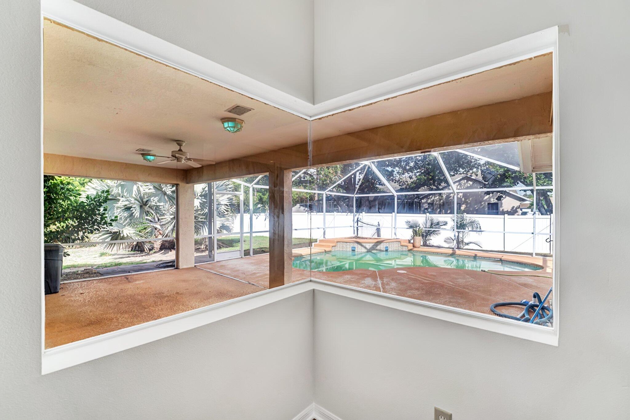 513 Southeast Cliff Road Port St. Lucie, FL 34984 - Photo 15 of 39 a room with window