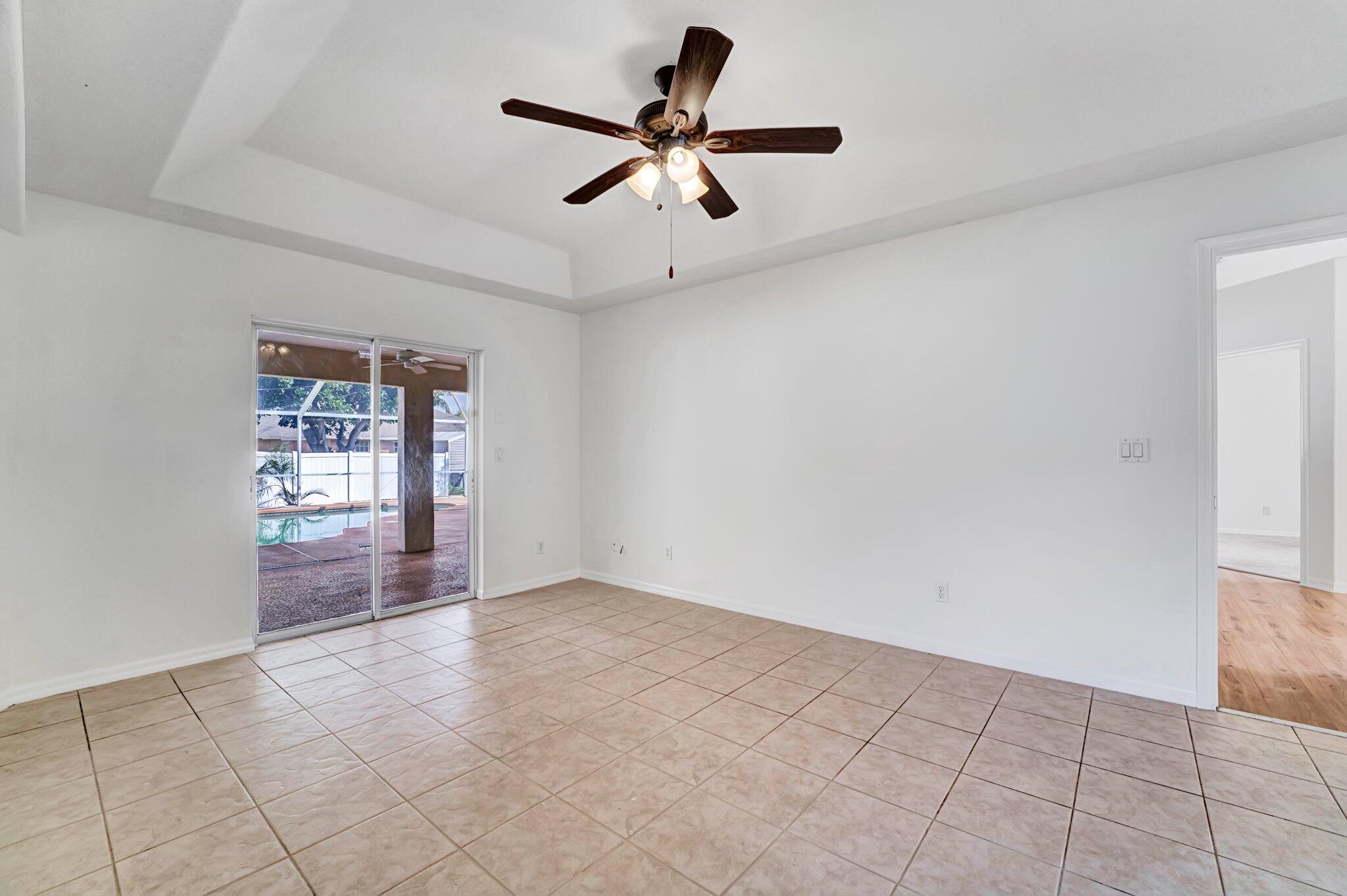 513 Southeast Cliff Road Port St. Lucie, FL 34984 - Photo 25 of 39 a view of an empty room