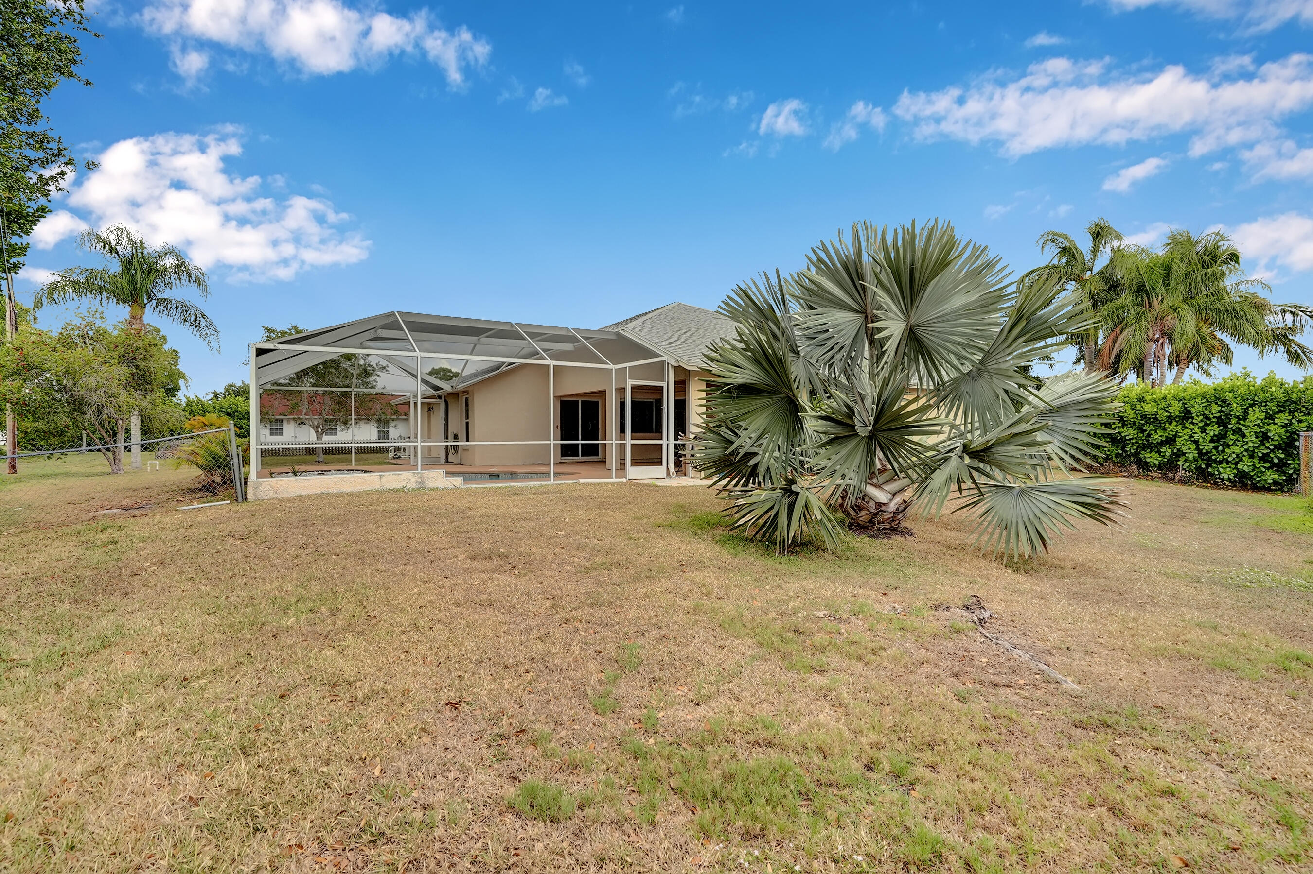 513 Southeast Cliff Road Port St. Lucie, FL 34984 - Photo 39 of 39 a front view of a house with a yard