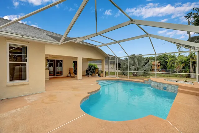 a view of a swimming pool with a patio