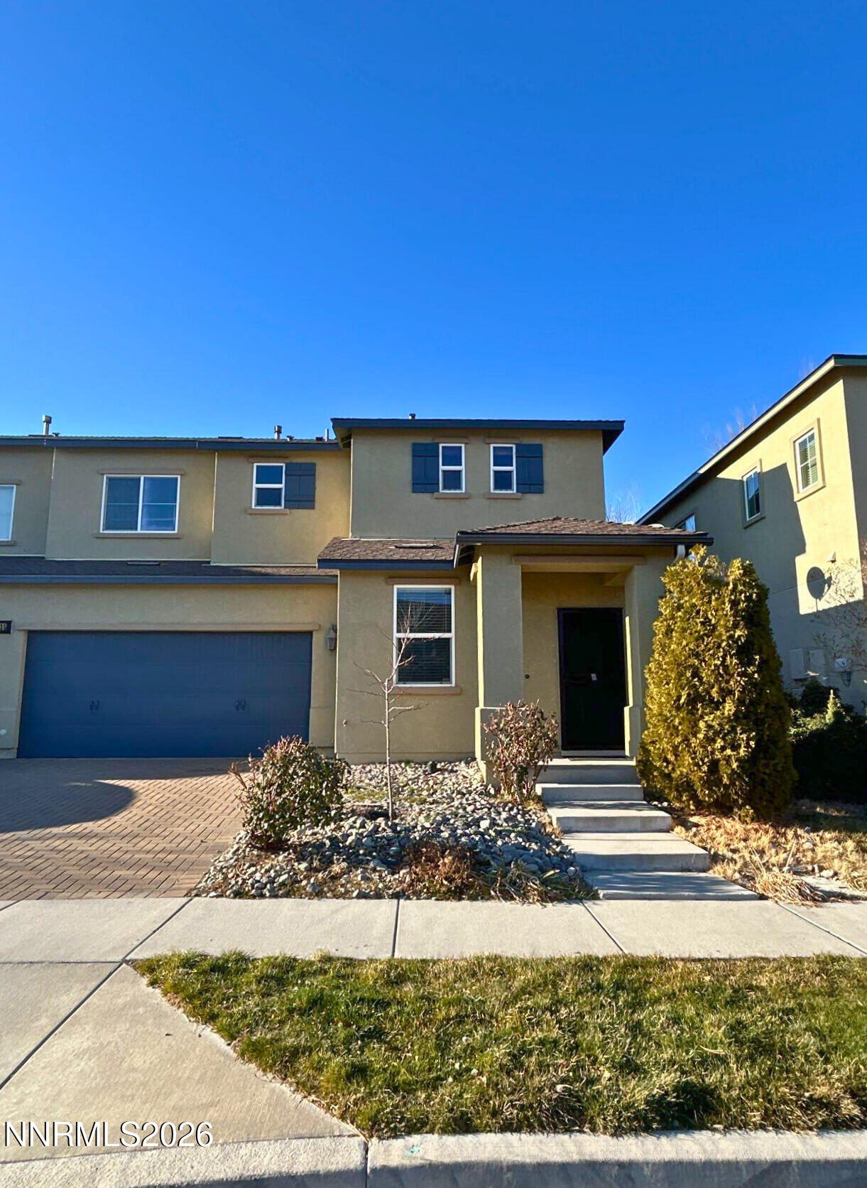 2035 Echo Valley Parkway Reno, NV 89521 - Photo 2 of 16 a front view of a house with a yard