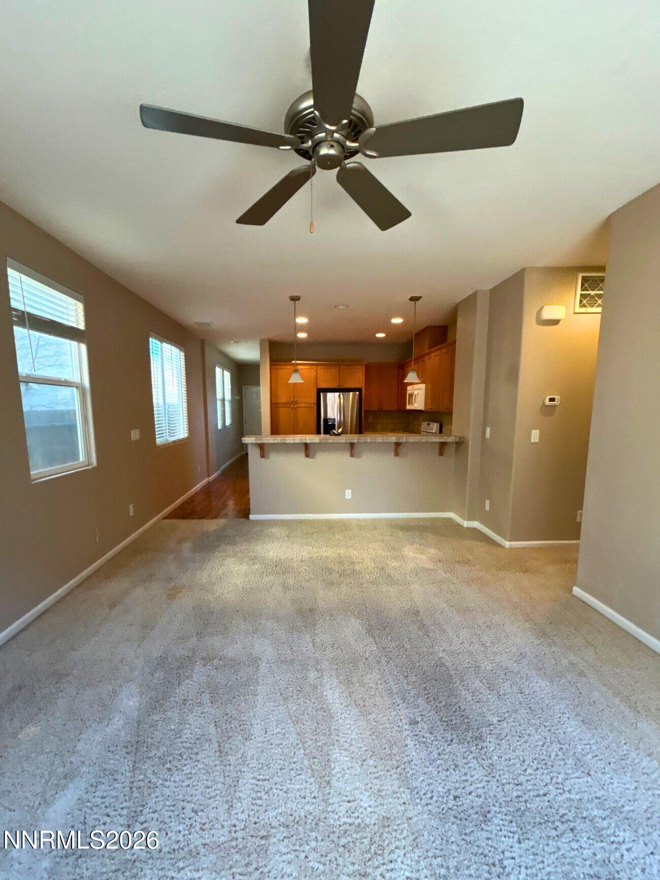 2035 Echo Valley Parkway Reno, NV 89521 - Photo 6 of 16 a view of a livingroom with a ceiling fan and window