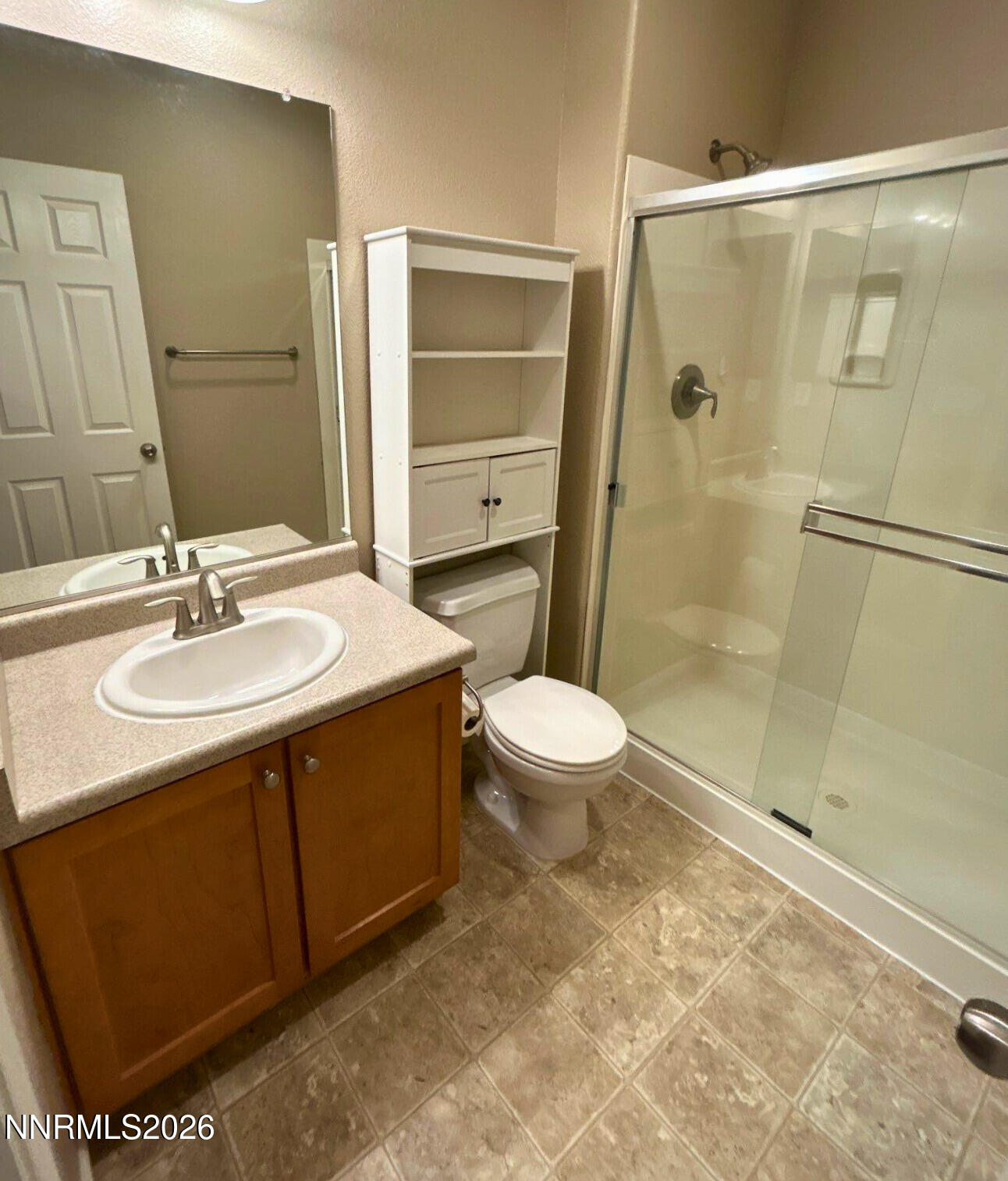 2035 Echo Valley Parkway Reno, NV 89521 - Photo 8 of 16 a bathroom with a sink a toilet and shower