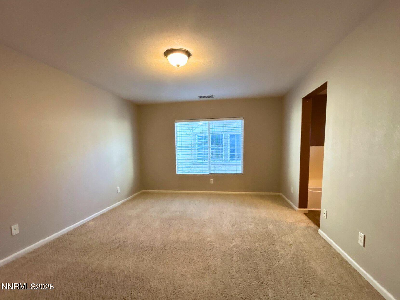 2035 Echo Valley Parkway Reno, NV 89521 - Photo 9 of 16 an empty room with windows