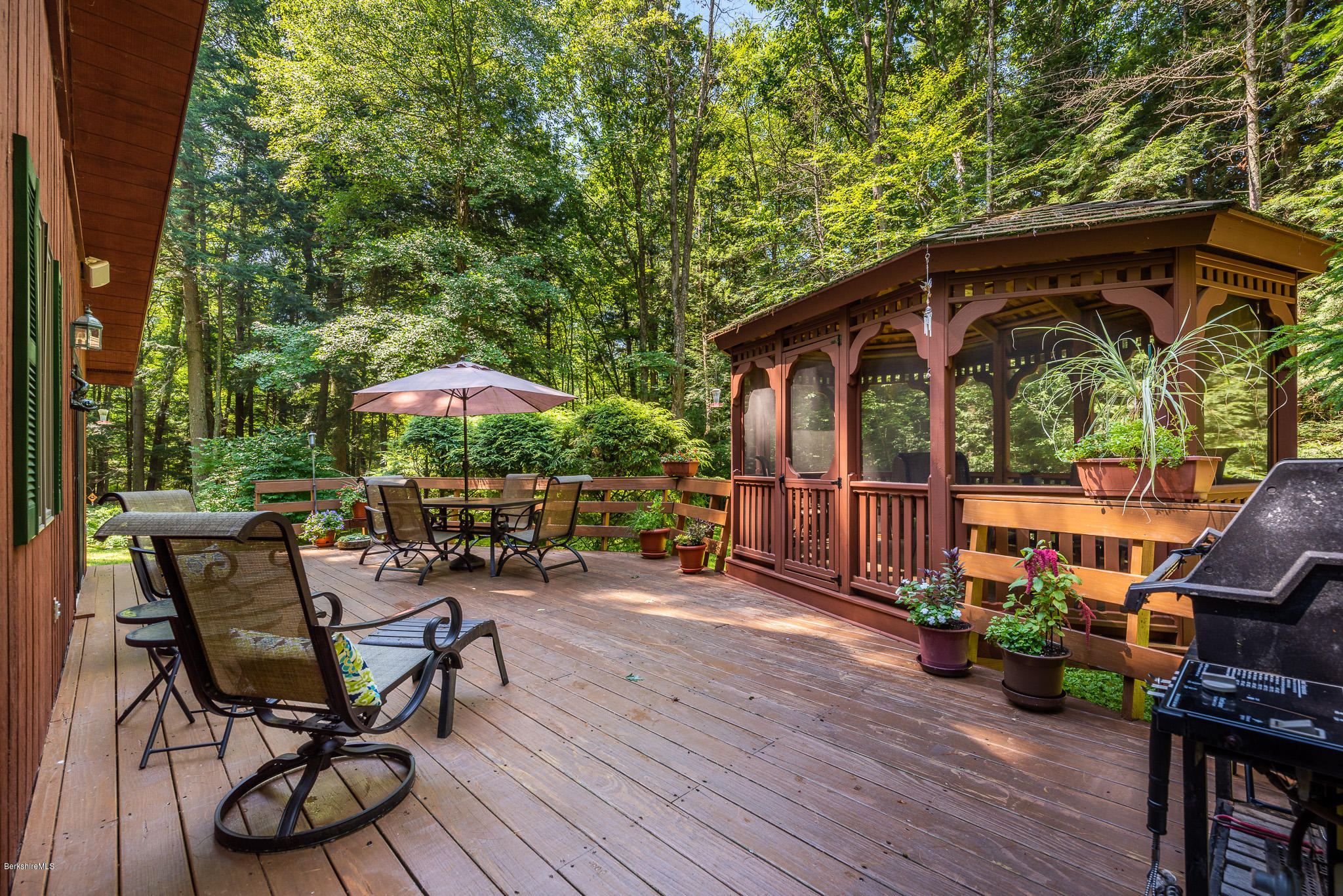 811 Salisbury Road Sheffield, MA 01257 - Photo 12 of 39 a view of a chairs and table in the patio with a fire pit