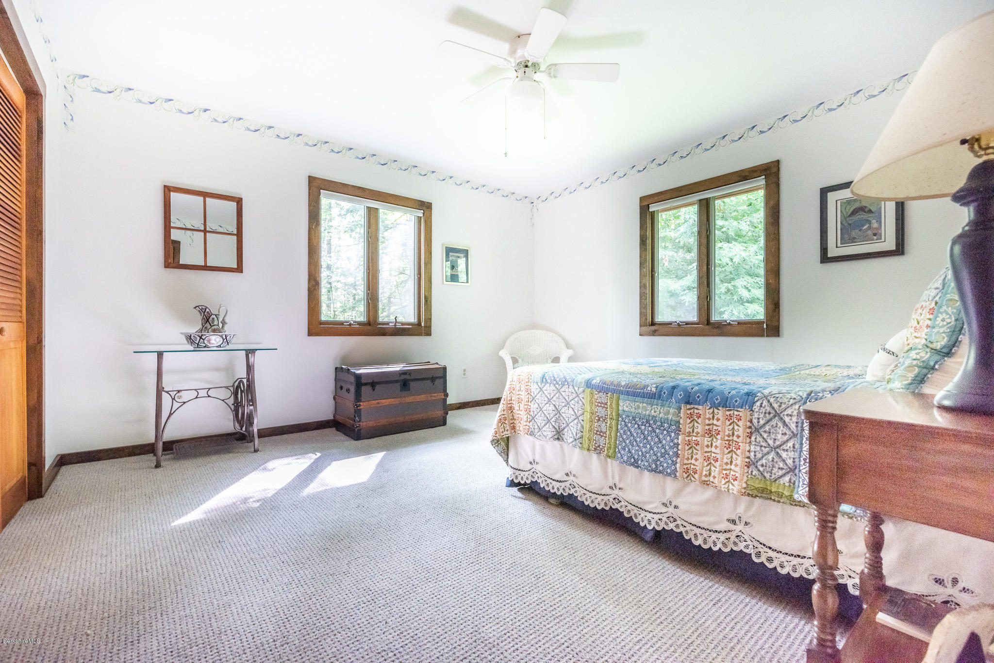 811 Salisbury Road Sheffield, MA 01257 - Photo 15 of 39 a spacious bedroom with a bed and a table chair
