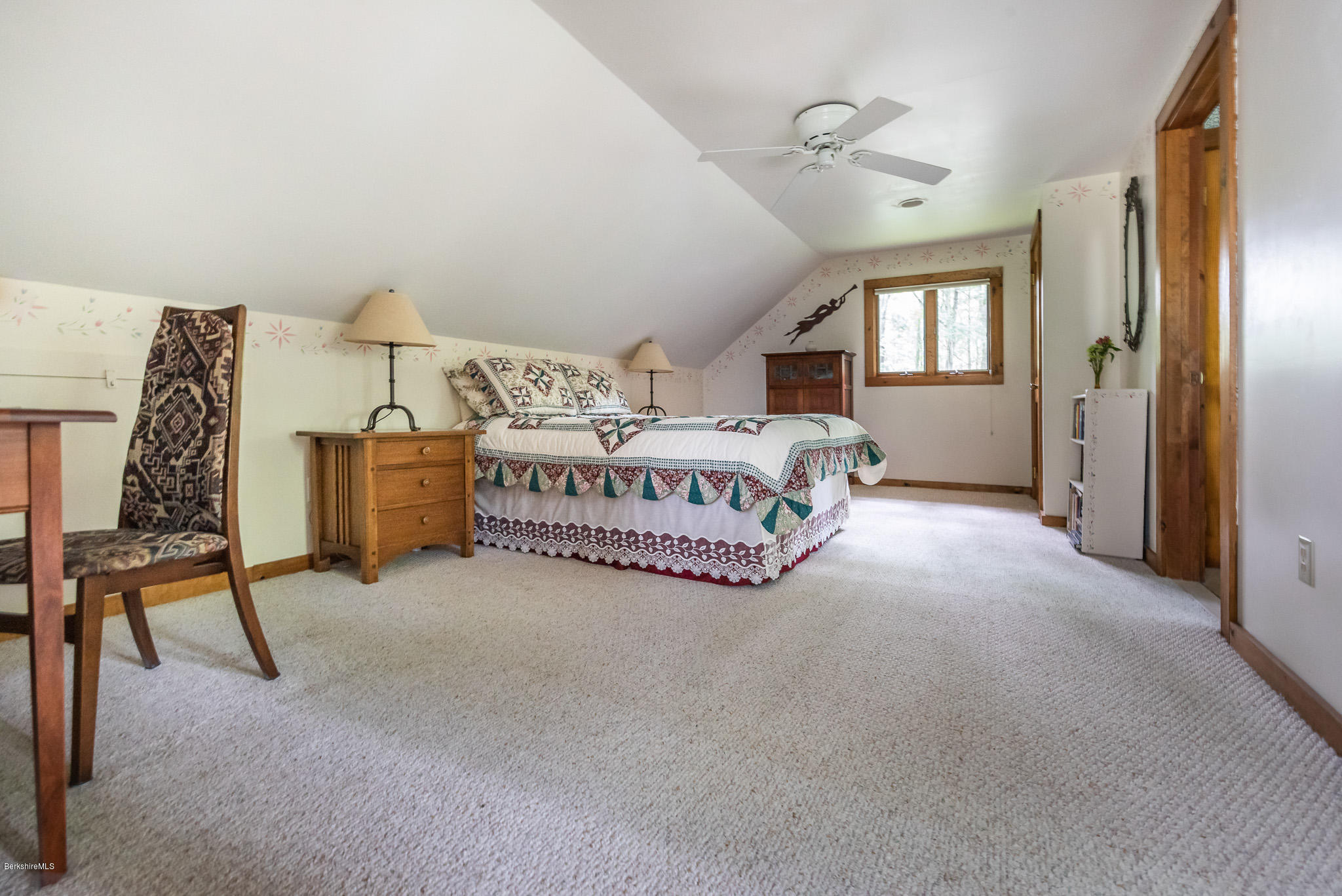 811 Salisbury Road Sheffield, MA 01257 - Photo 18 of 39 a spacious bedroom with a bed table chair and window
