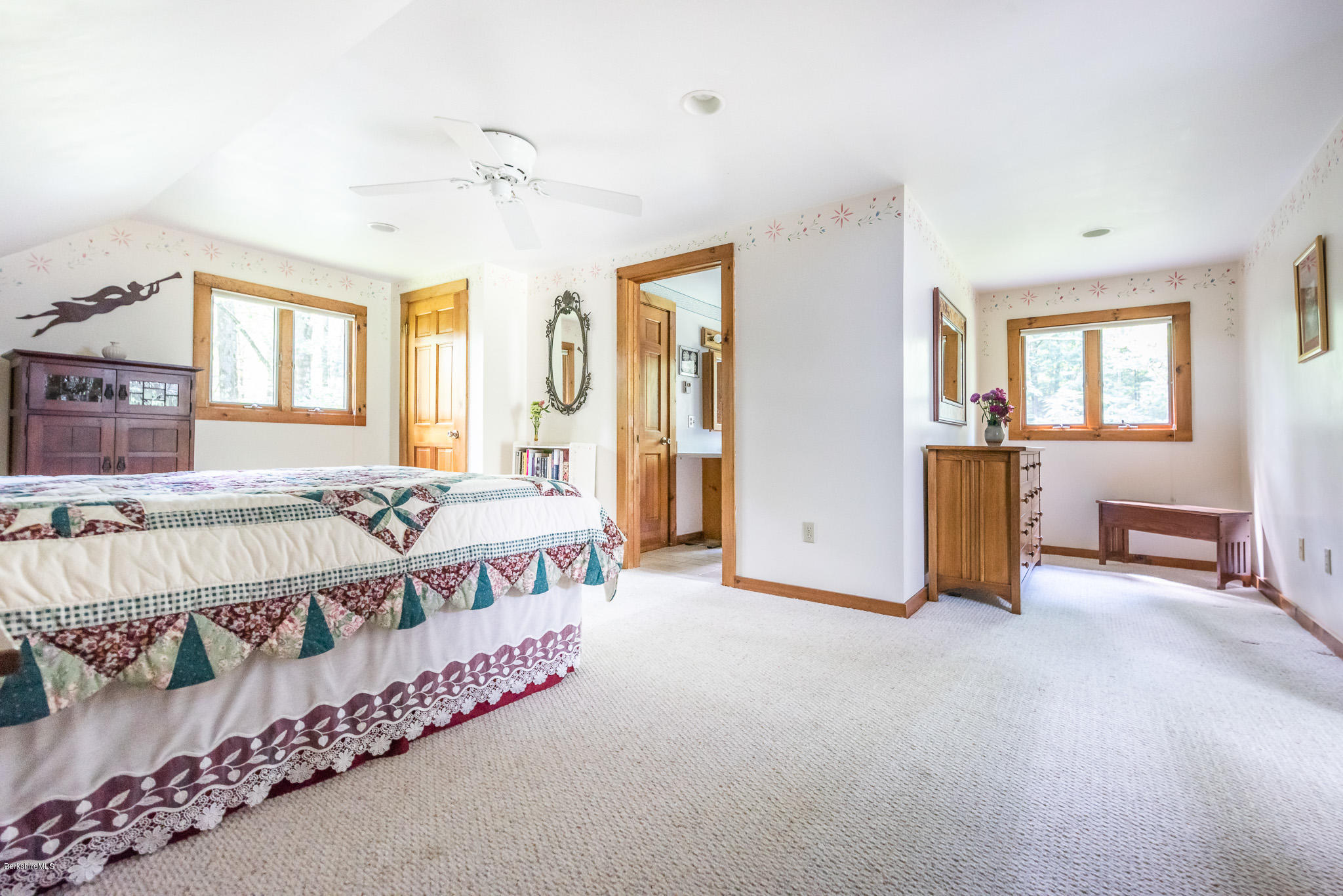 811 Salisbury Road Sheffield, MA 01257 - Photo 20 of 39 a spacious bedroom with a bed and a table