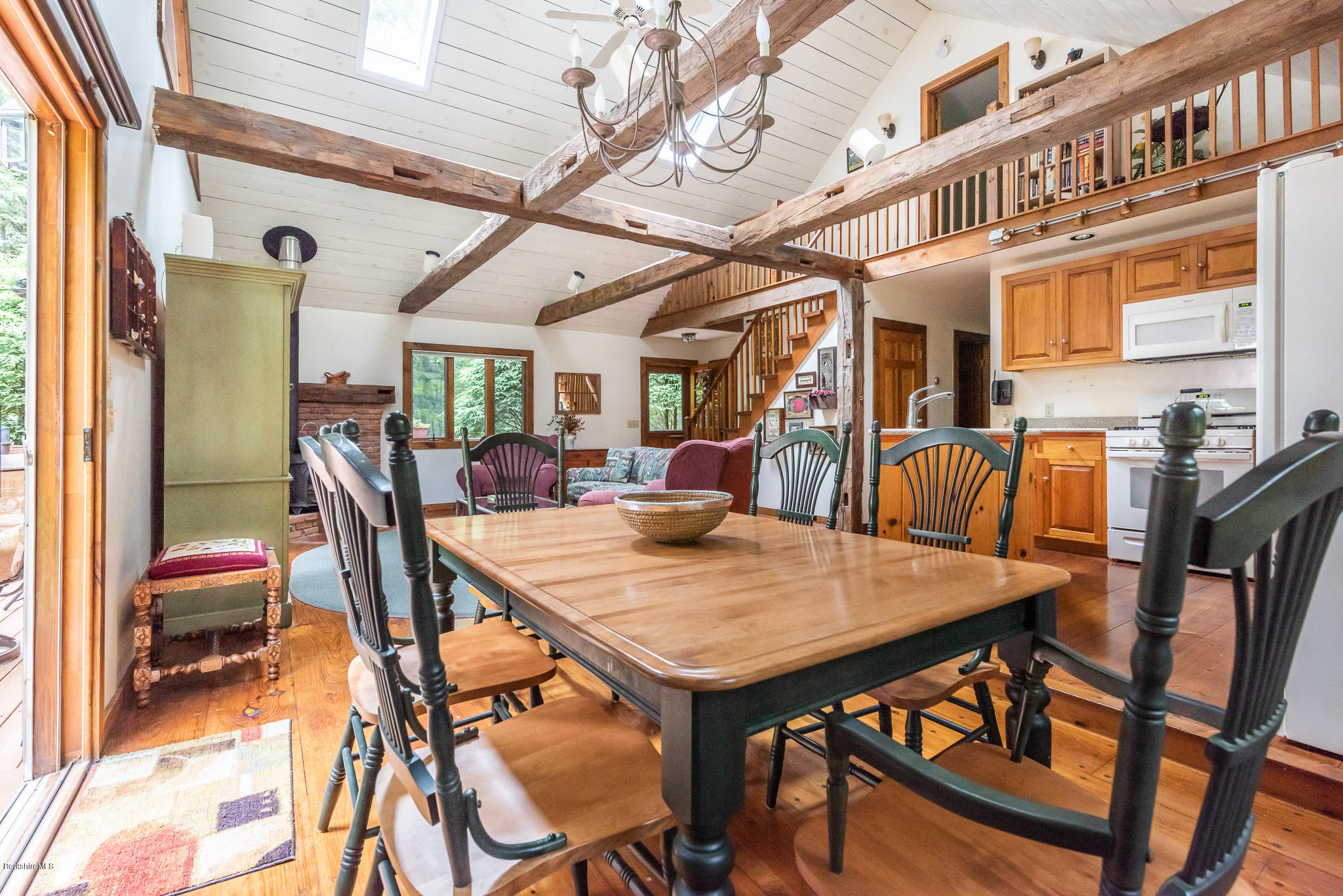 811 Salisbury Road Sheffield, MA 01257 - Photo 7 of 39 a view of a dining room with furniture and a chandelier