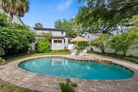 a view of a swimming pool with a patio