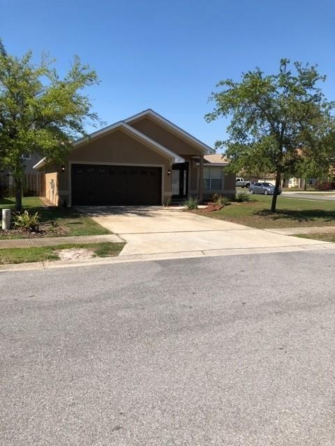 12 Red Maple Court Santa Rosa Beach, FL 32459 - Photo 3 of 24 a view of a house with a yard and large tree
