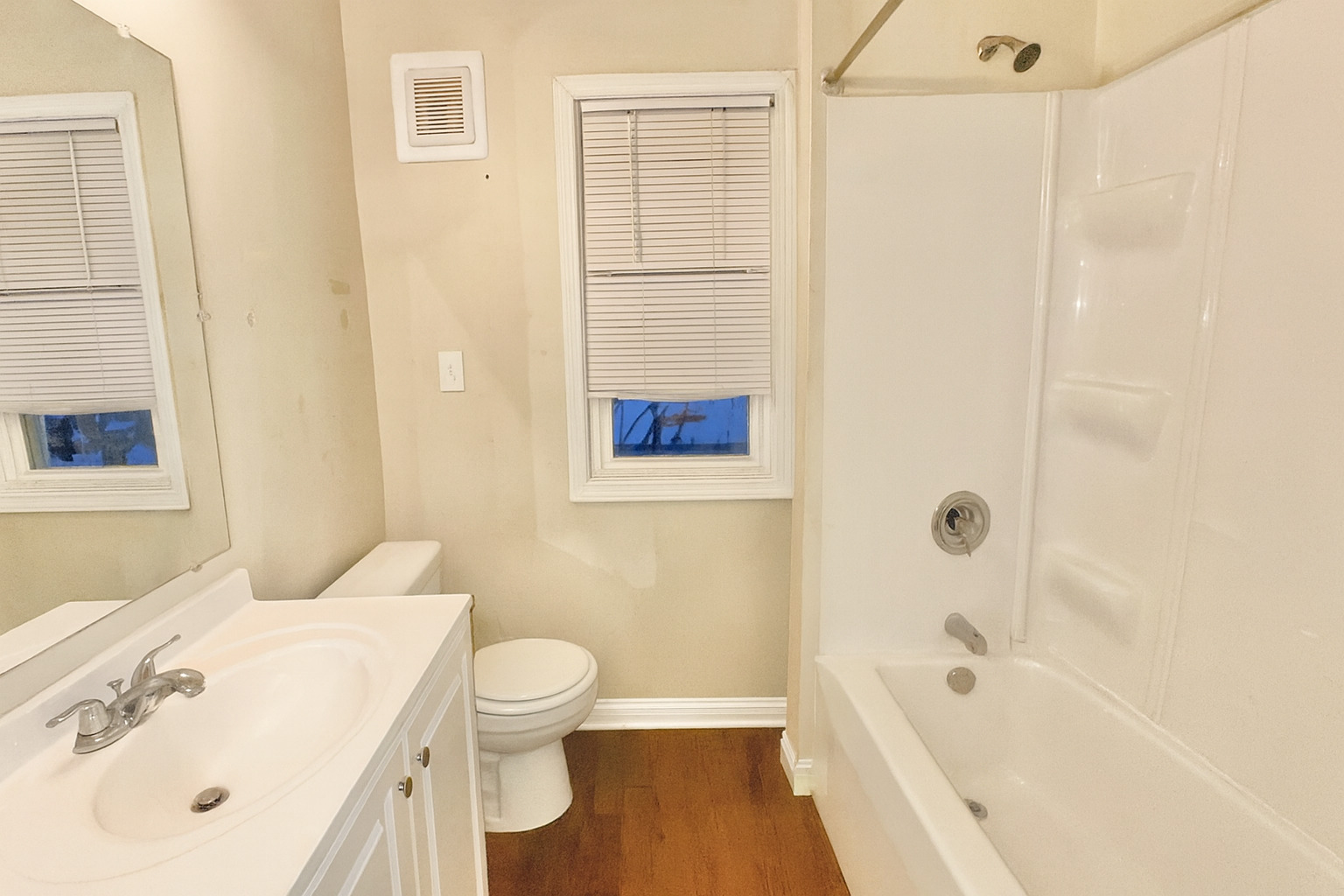 640 South Spencer Street Aurora, IL 60505 - Photo 7 of 15 a bathroom with a bathtub shower sink vanity and toilet