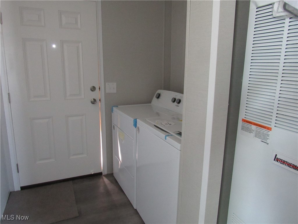 30 Kyle Lane Akron, OH 44310 - Photo 18 of 23 Clothes washing area featuring washing machine and clothes dryer and dark wood-type flooring