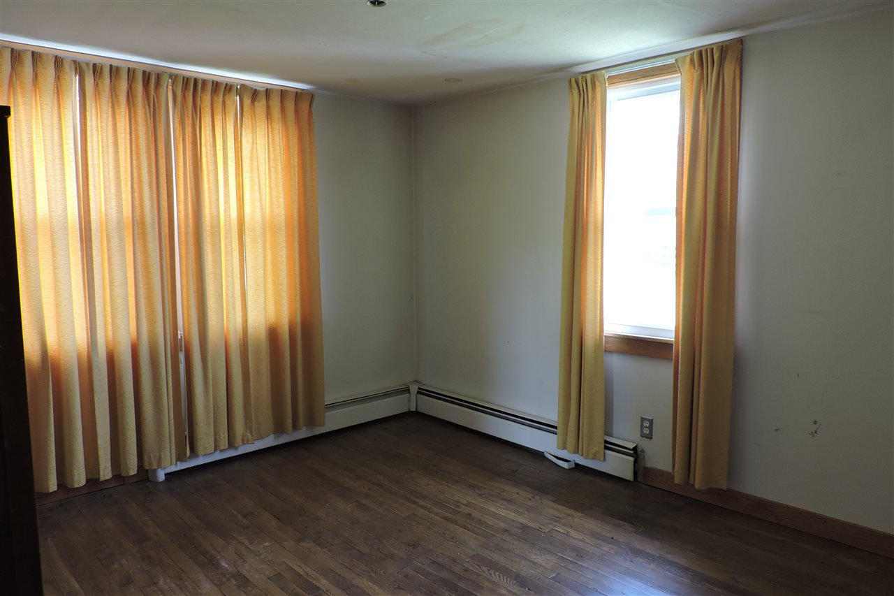 937 Cales Springs Road Middlebrook, VA 24459 - Photo 25 of 27 an empty room with wooden floor and windows