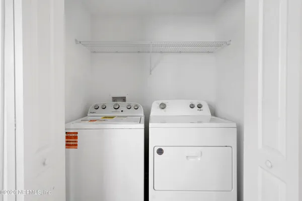 a utility room with dryer and washer