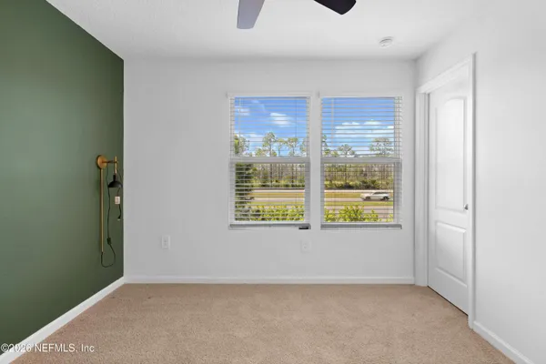 a view of an empty room with a window