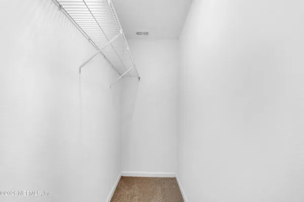 a bathroom with a shower sink and mirror