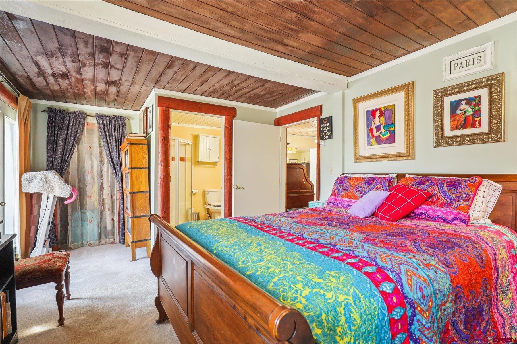 6815 County Road 203 Durango, CO 81301 - Photo 12 of 35 a bedroom with a bed and a large window