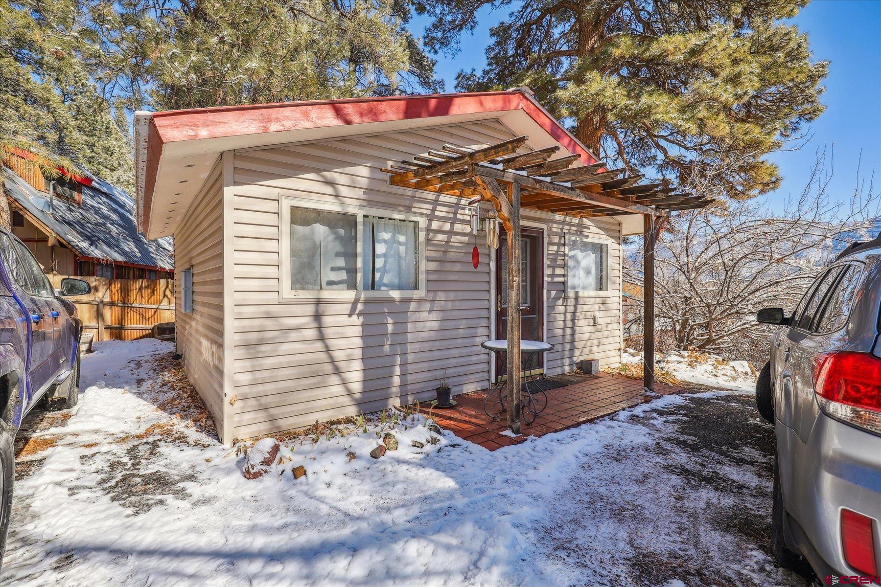 6815 County Road 203 Durango, CO 81301 - Photo 23 of 35 a view of a house with a snow on the wall