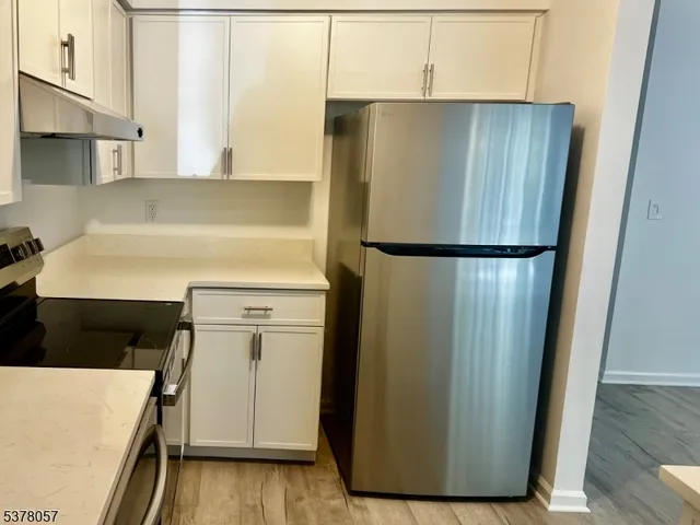 a white refrigerator freezer sitting in a kitchen