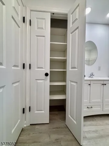 a view of a hallway with closet