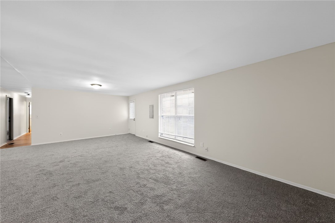 6070 Charlesgate Road Huber Heights, OH 45424 - Photo 11 of 29 This expansive living area offers a neutral palette, awaiting your personal touch and design.