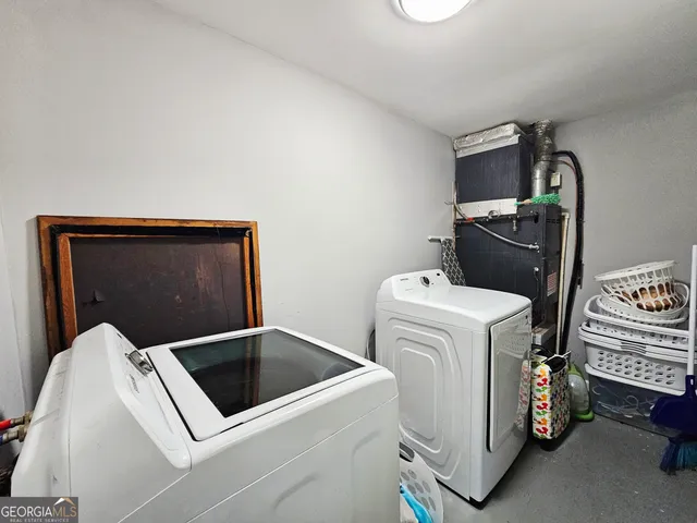 a utility room with dryer and washer
