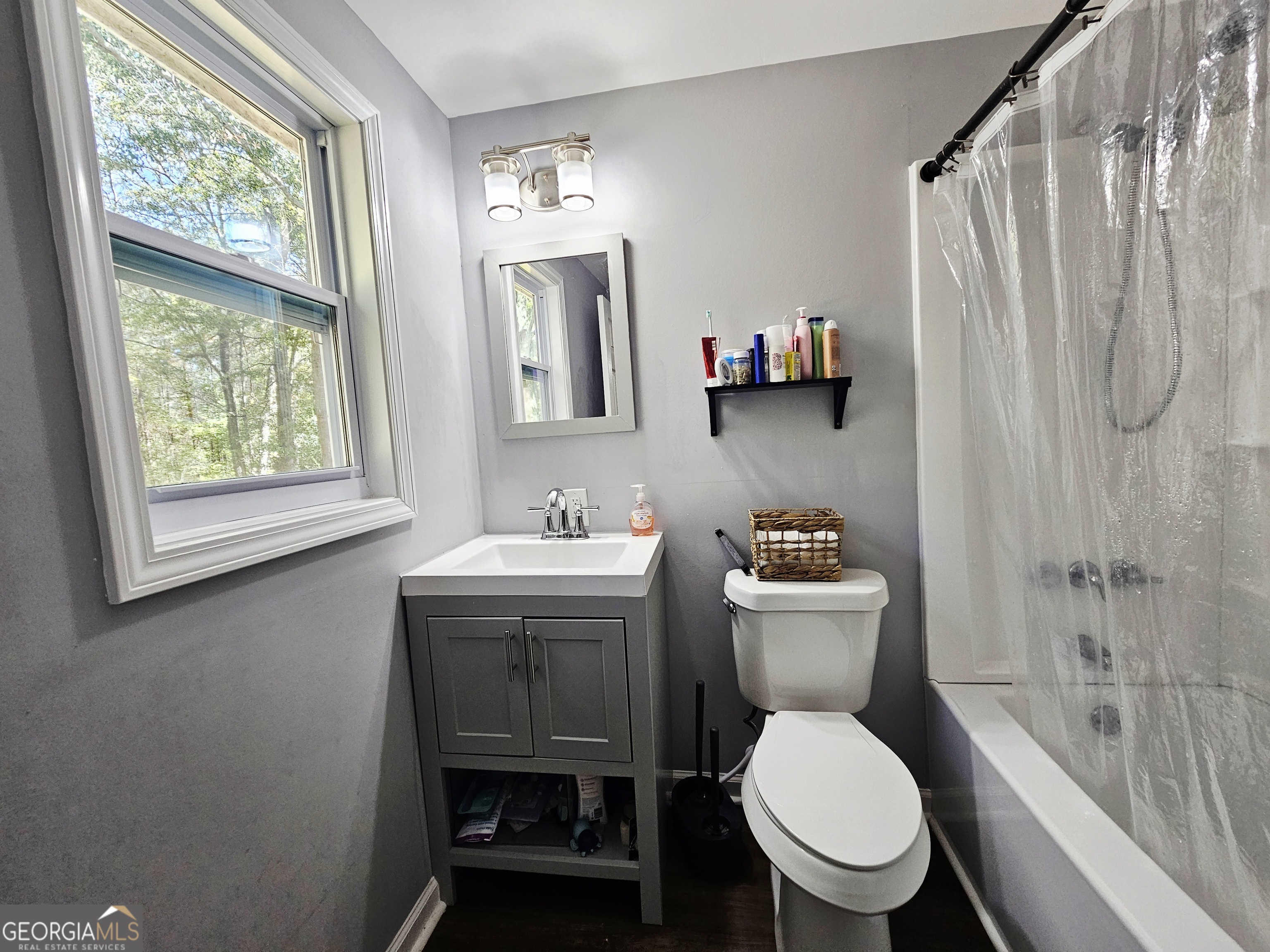 46 Gammon Road Carrollton, GA 30117 - Photo 10 of 17 a bathroom with a toilet a sink and a shower
