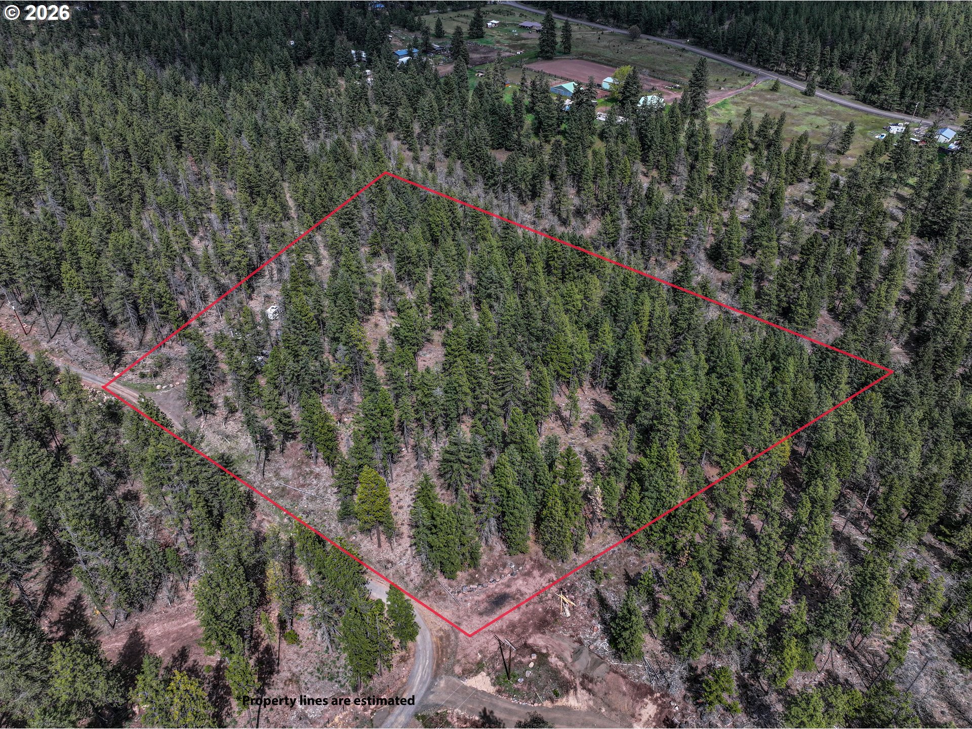 29 Weona Road Goldendale, WA 98620 - Photo 1 of 23 a backyard of a house with lots of green space and mountain view
