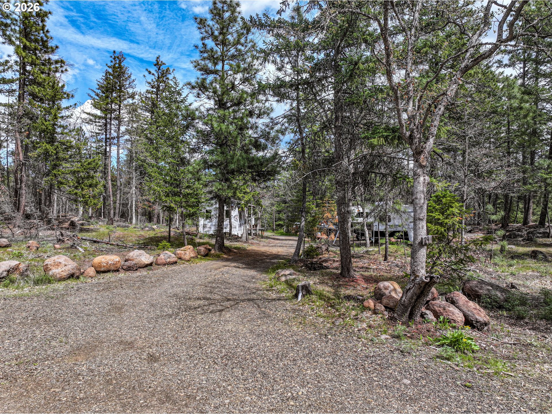 29 Weona Road Goldendale, WA 98620 - Photo 2 of 23 a backyard of a house with lots of green space