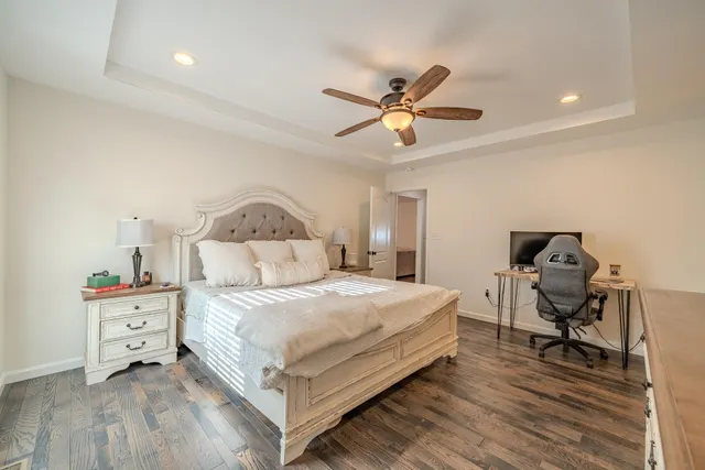 a living room with washing machine and a mirror