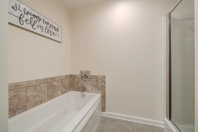 a bed room with a bed and a window