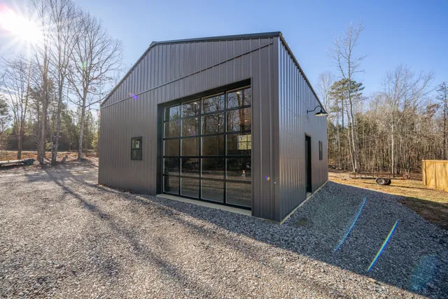 a view of a garage with a car parked in it