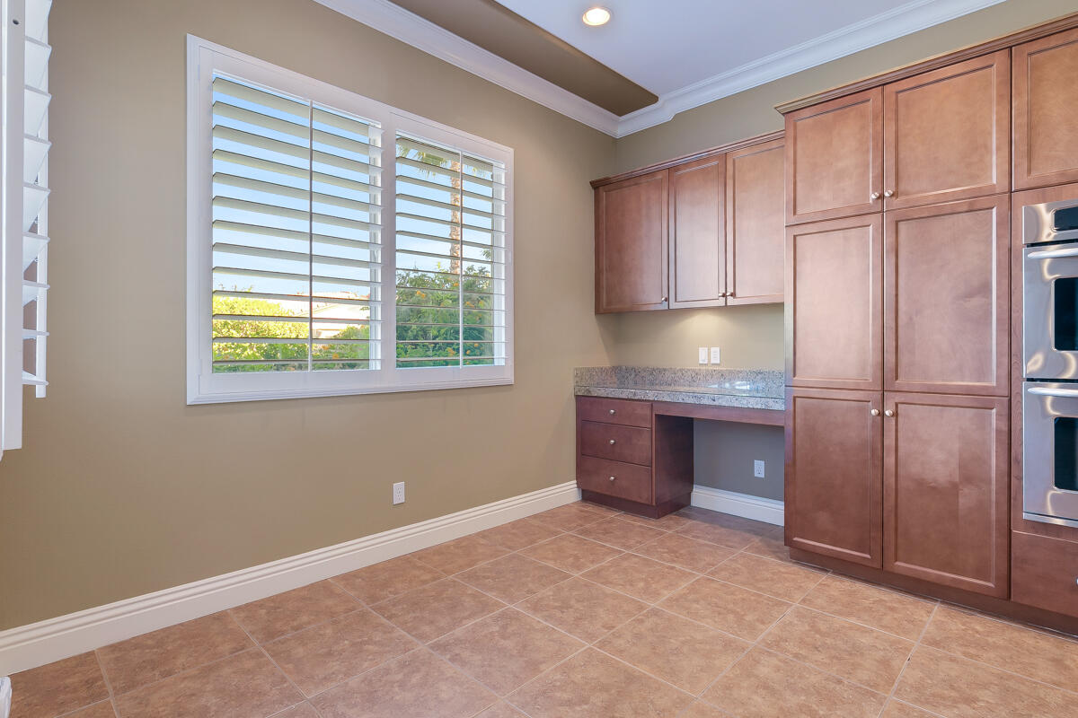 112 Rosetta Court Palm Desert, CA 92211 - Photo 15 of 41 a kitchen with granite countertop cabinets and window