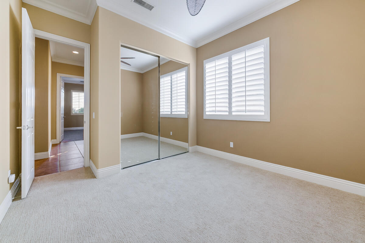 112 Rosetta Court Palm Desert, CA 92211 - Photo 18 of 41 an empty room with windows and closet