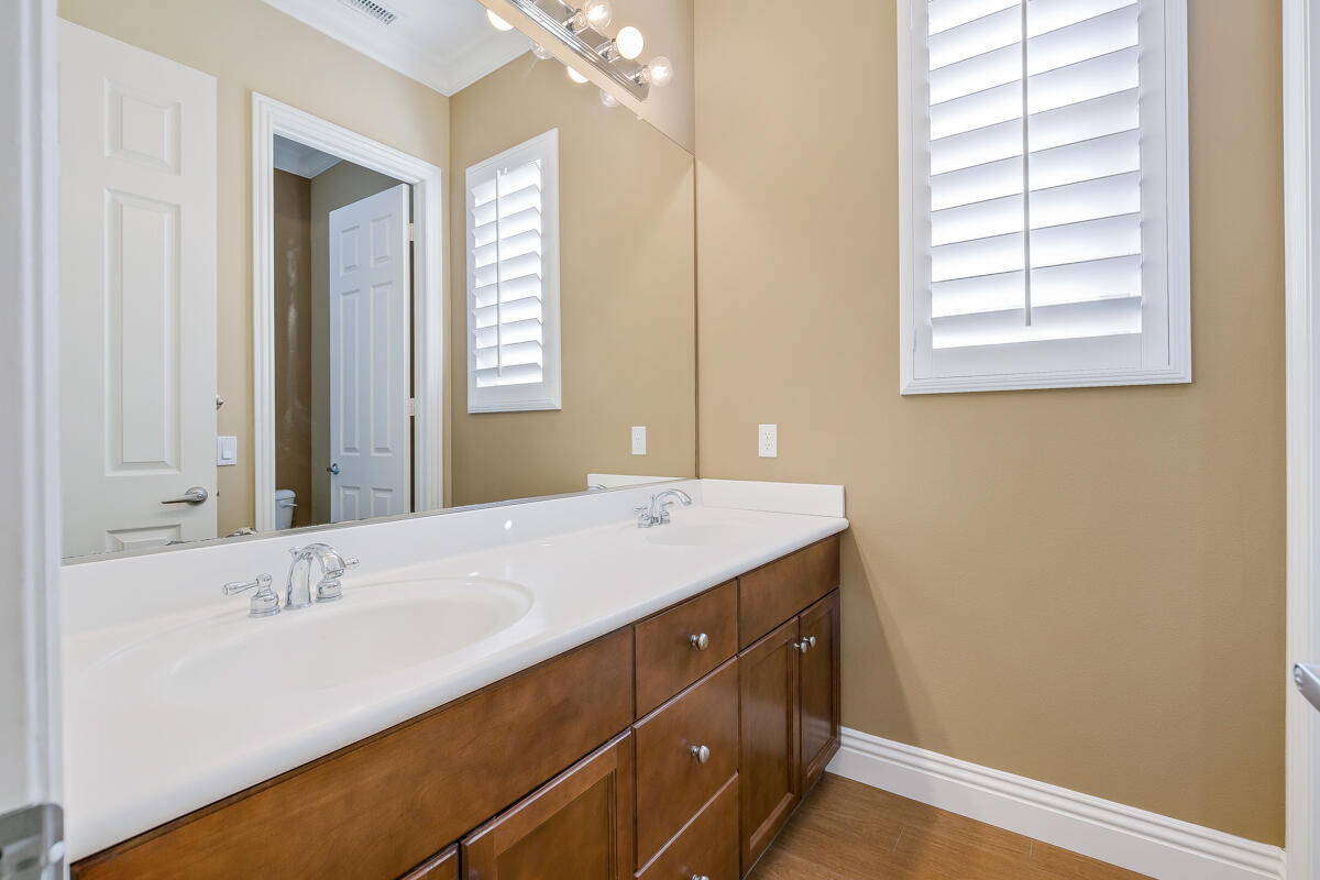 112 Rosetta Court Palm Desert, CA 92211 - Photo 19 of 41 a bathroom with a sink and a mirror