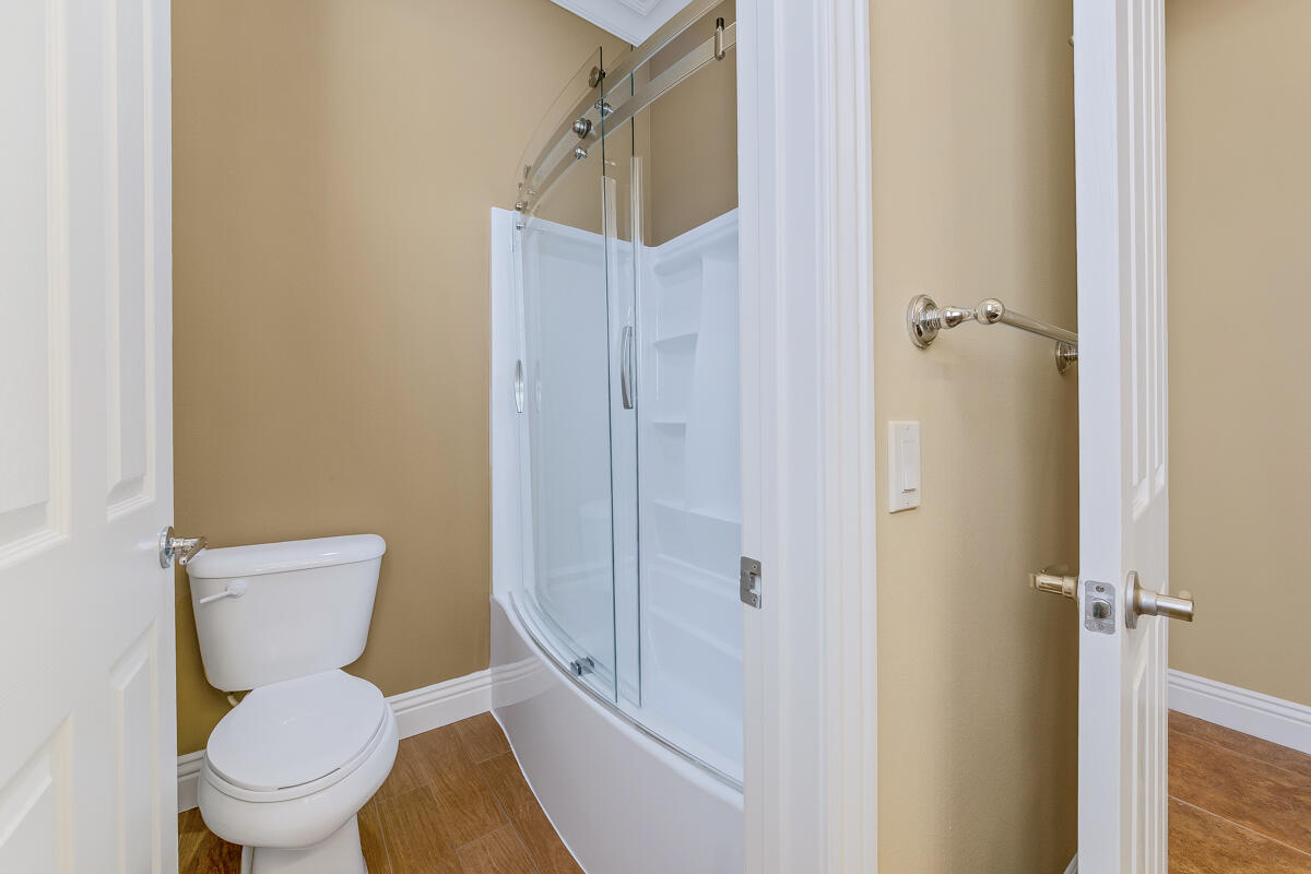 112 Rosetta Court Palm Desert, CA 92211 - Photo 20 of 41 a white toilet sitting next to a bathroom sink