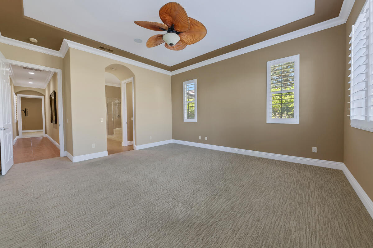 112 Rosetta Court Palm Desert, CA 92211 - Photo 24 of 41 an empty room with windows and fan