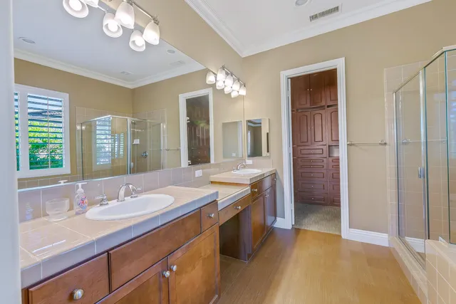 wooden floor with a bathroom