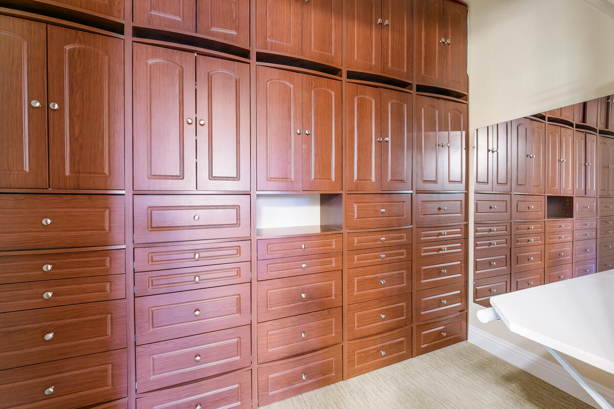 112 Rosetta Court Palm Desert, CA 92211 - Photo 28 of 41 a view of a dresser with wooden cabinets