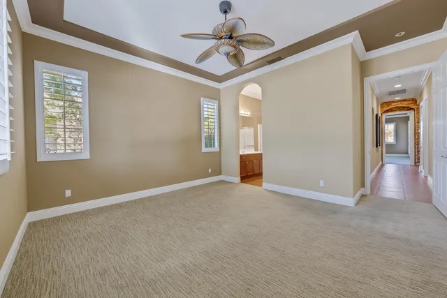 a view of a lake with couches in the patio