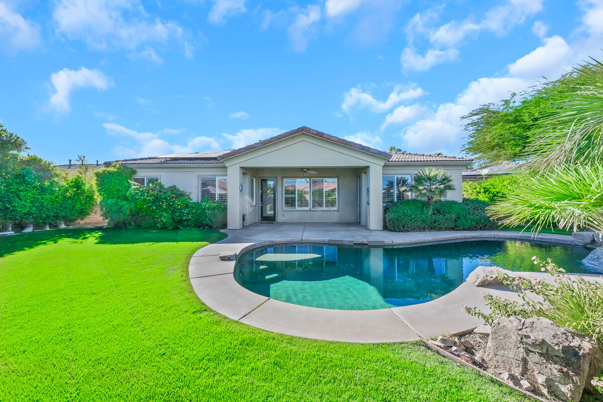 112 Rosetta Court Palm Desert, CA 92211 - Photo 36 of 41 a view of a house with swimming pool and a yard