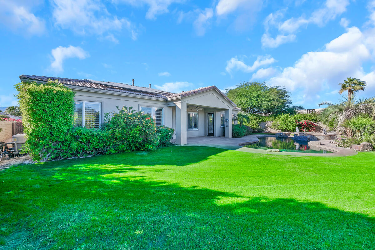 112 Rosetta Court Palm Desert, CA 92211 - Photo 37 of 41 a view of a house with a backyard and a patio