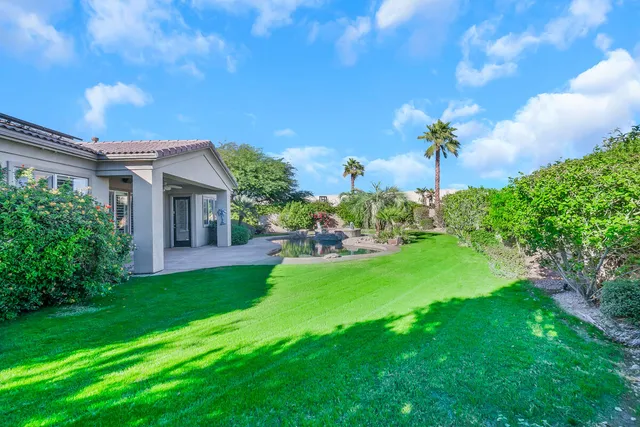 an empty room with windows and yard