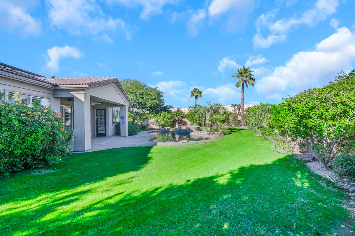 112 Rosetta Court Palm Desert, CA 92211 - Photo 38 of 41 a front view of a house with a garden