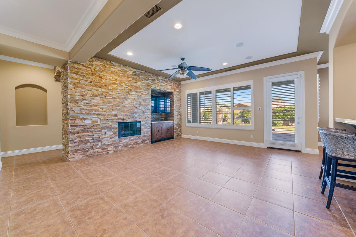112 Rosetta Court Palm Desert, CA 92211 - Photo 5 of 41 a view of an empty room with a fireplace and a window