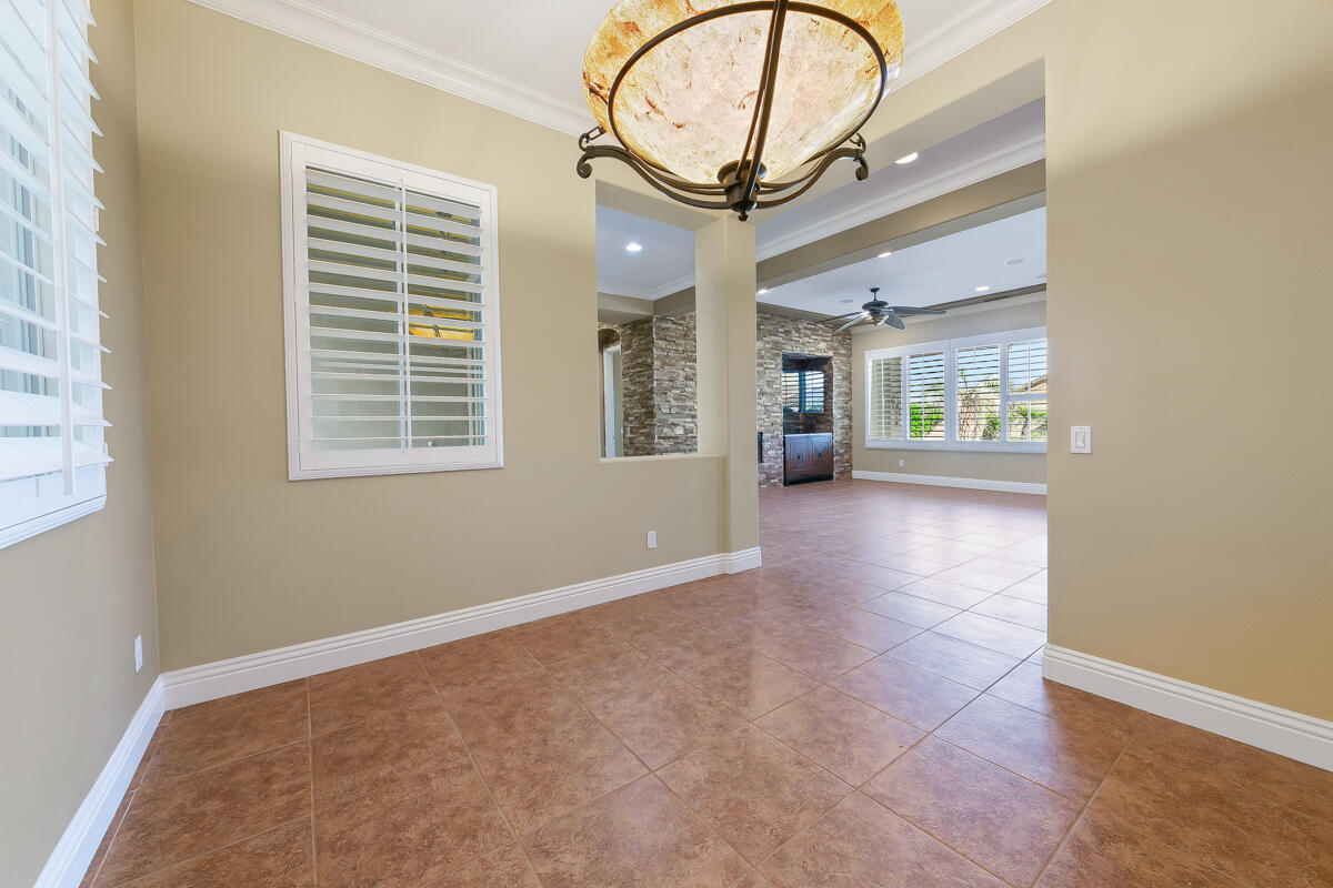 112 Rosetta Court Palm Desert, CA 92211 - Photo 8 of 41 an entryway with wooden floor and a window