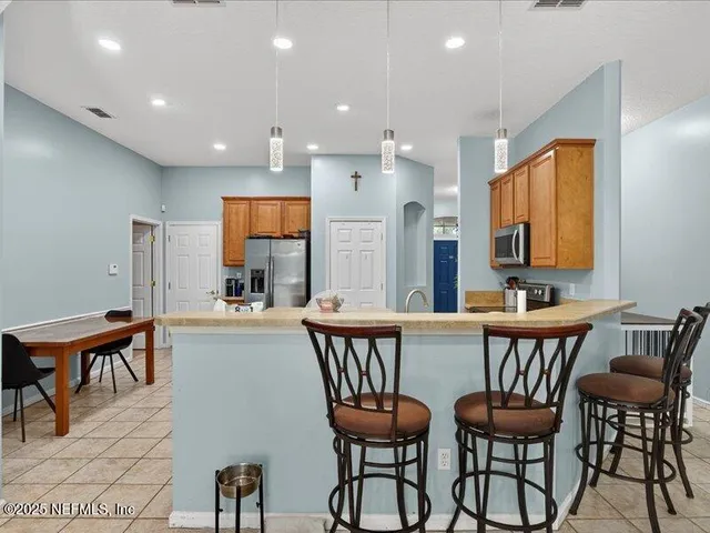 a dining room with furniture and window